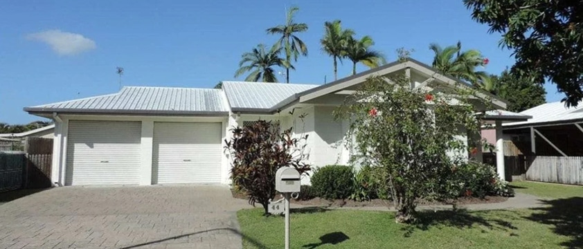 Photo of a a house in a neighborhood.